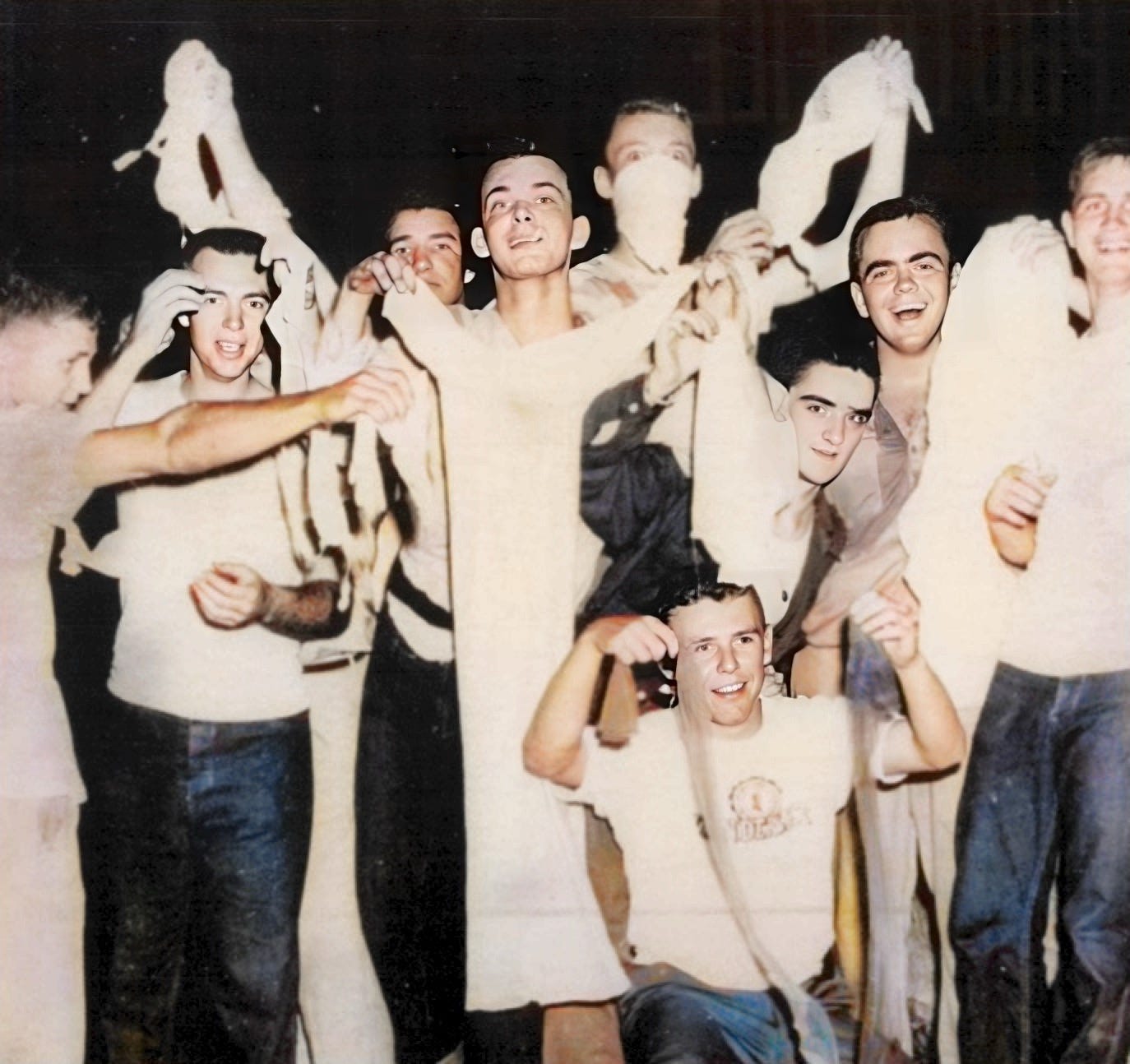 Group of Notre Dame boys holding lingerie from a recent Panty Raid at Saint Mary's College.  Biography of Dr. Anthony J. Carbone.