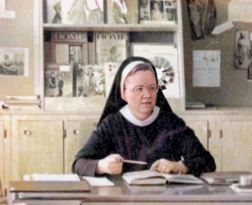 Photograph of older religious sister at a desk at Saint Mary's College.  Biography of Dr. Anthony J. Carbone.