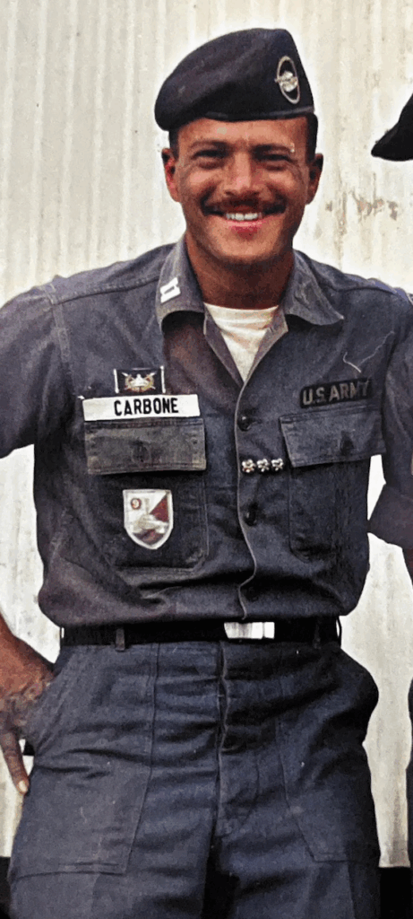 Captain Tony Carbone wearing U.S. Army fatigues with a black tanker's beret.  ARVN Armor Badge on his chest.  Biography of Dr. Anthony J. Carbone.