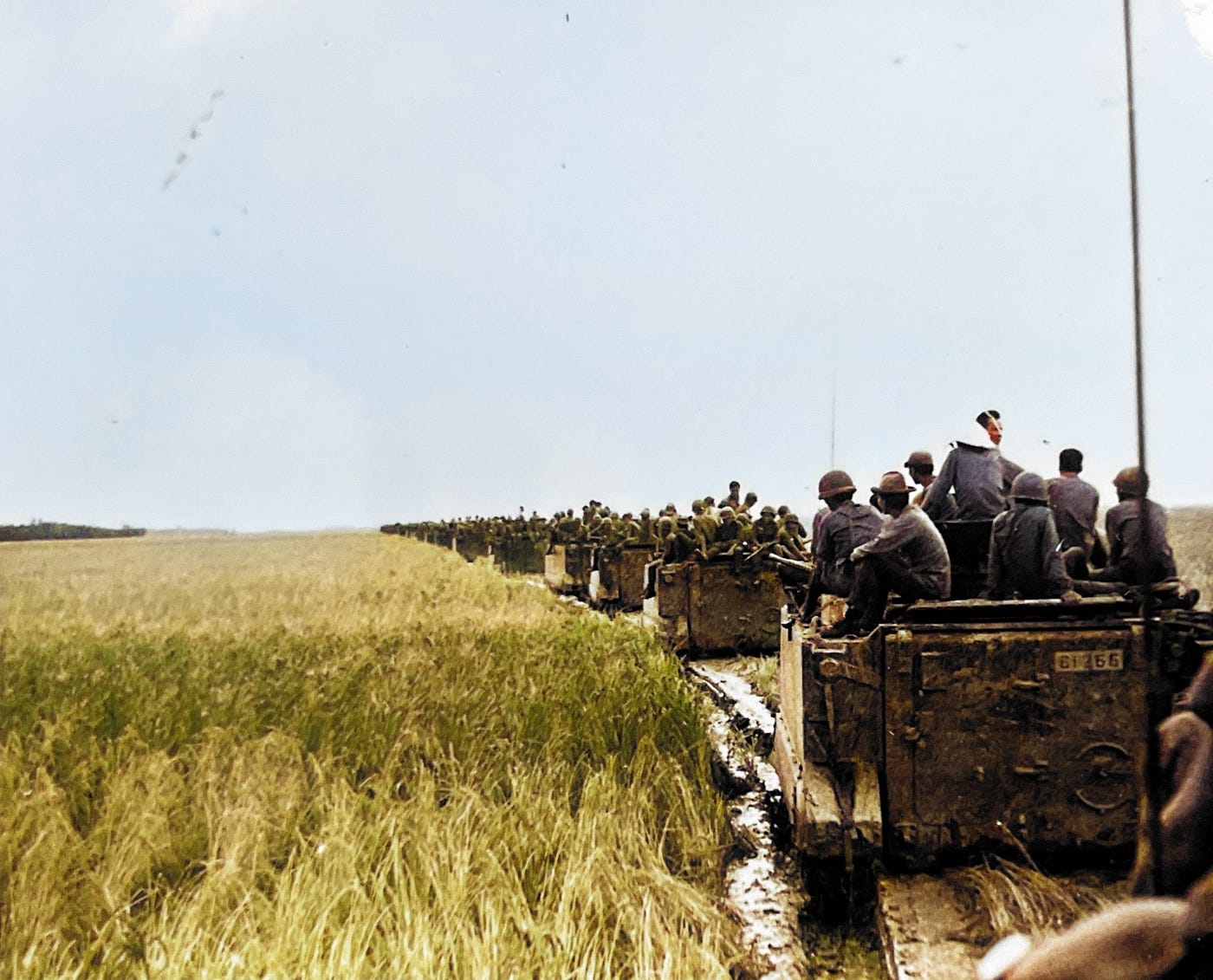 Republic of Vietnam Armored Unit on Patrol in Mekong Delta.  Line of American made M113 armored personnel carriers (APCs) and M114 armored reconnaissance vehicles.
Part of the autobiography of Dr. Anthony J. Carbone, Son in the Shadow of a Green Beret Hero.