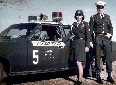 U.S. Army Military Police (MP) Sedan circa 1970 with male and female MPs in Class A uniforms.  Part of Biography of Dr. Anthony J. Carbone
