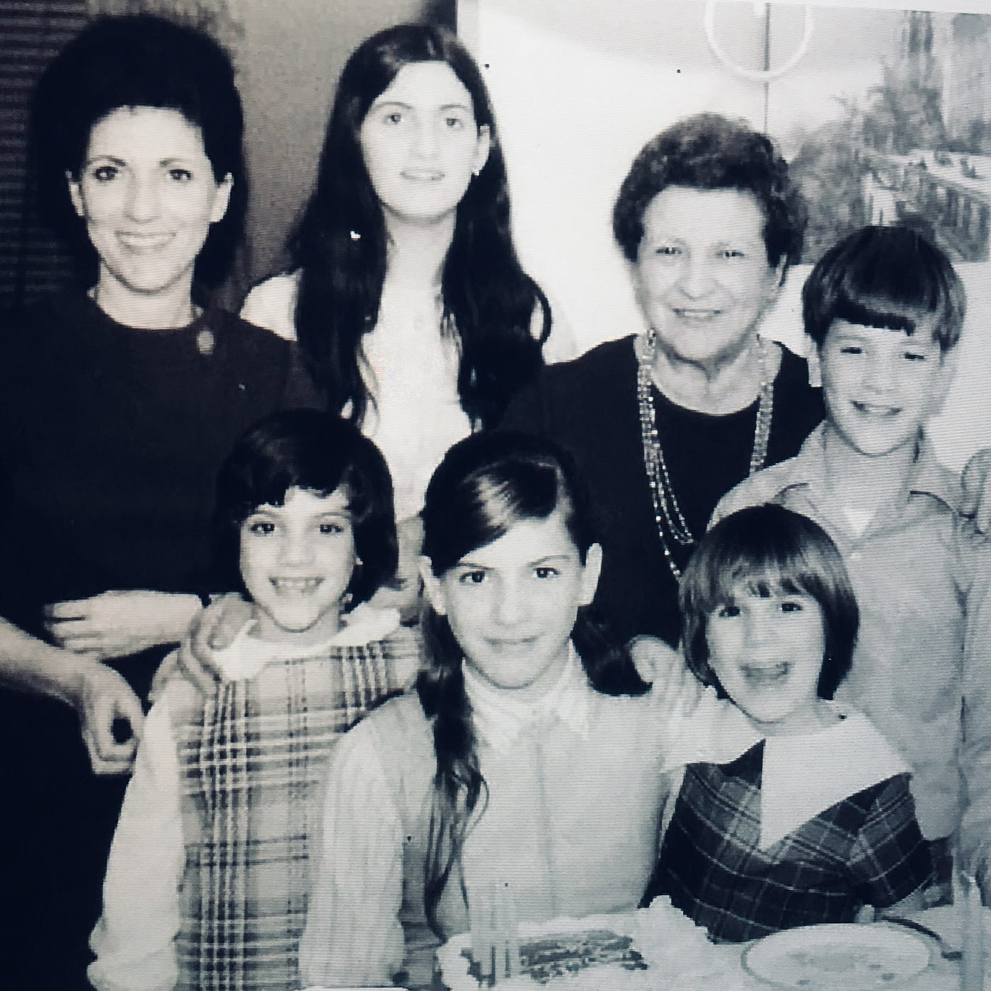 Photograph of Nana Carbone visiting us at our home in Mark Twain Village in Heidelberg, Germany.  With my mother (Edda Carbone), Sisters Lynne, Diana, Cynthia and Pamela Carbone.  Looks like it was my sister Diana's birthday with a birthday cake.  I am on the far left.

Part of the autobiography of Dr. Anthony J. Carbone, Son in the Shadow of a Green Beret Hero
