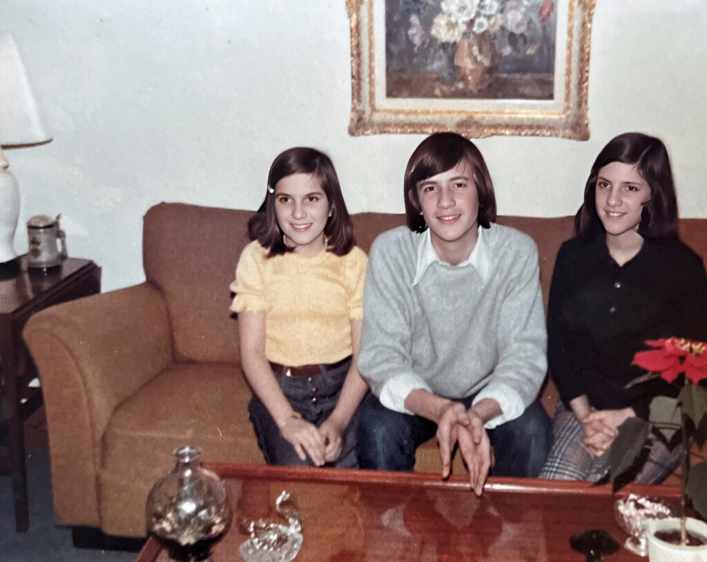 Sitting on the sofa (governement issue) in our home in the French Quarters of Bad Kreuznach Housing Area with my two younger sisters, Cynthia and Pamela.  Autobiography of Dr. Anthony J. Carbone.