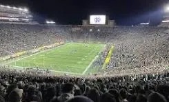 Notre Dame Stadium from ND Freshmen Section Perspective.  Biography of Dr. Anthony J. Carbone.