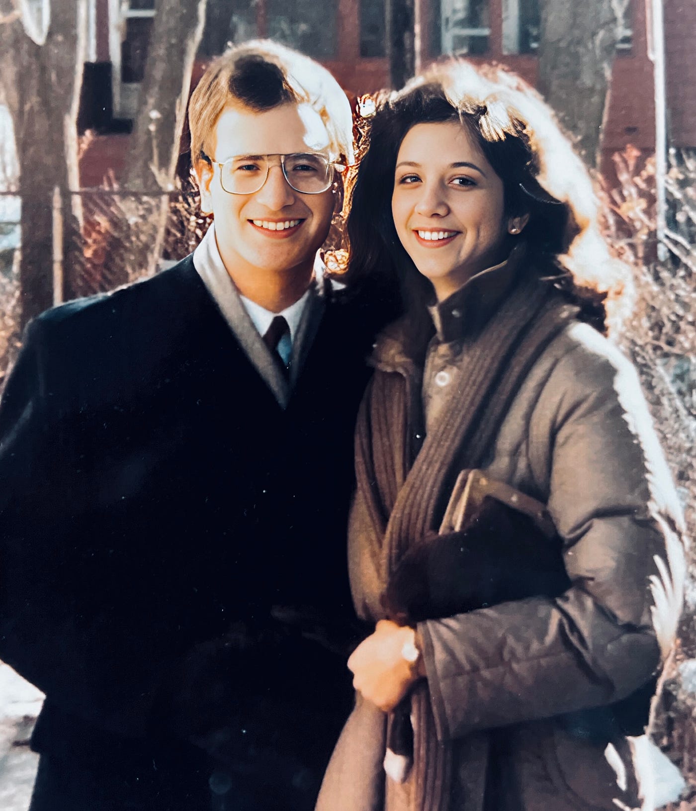 Photograph of Anthony J. Carbone with Mariann Schmitz in winter coats with scarves.