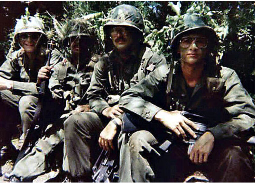 Photograph of me and 3 of my squad members in fatigues, camouflaged steel pot helmets, tactical gear and carrying our M16A1 rifles during tactical training at Army ROTC Advanced Camp.Biography of Dr. Anthony J. Carbone.