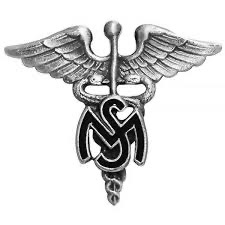 U.S. Army Medical Service Corps officer branch insignia.  Biography of Dr. Anthony J. Carbone.