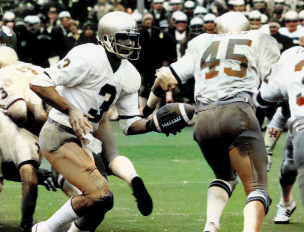 Joe Montana (#3) hands football of to Vagas Ferguson (#45) during the Cotton Bowl on January 1, 1979.  Autobiography of Dr. Anthony J. Carbone.