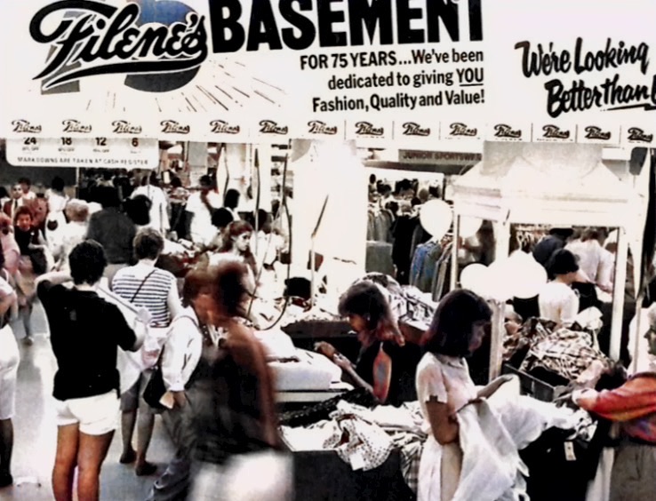 Filene's Basement in Downtown Crossing of Boston showing women shopping clothes.  Autobiography of Dr. Anthony J. Carbone.