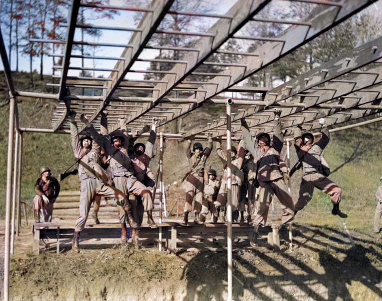 U.S. Army ROTC Cadets performing Physical Training (PT) on the horizontal ladder.  Biography of Dr. Anthony J. Carbone.