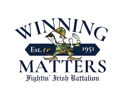 University of Notre Dame Army ROTC logo with Fighting Irish leprachan in camouflage fatigues.  "Winning Matters. Established 1951".  Biography of Dr. Anthony J. Carbone.