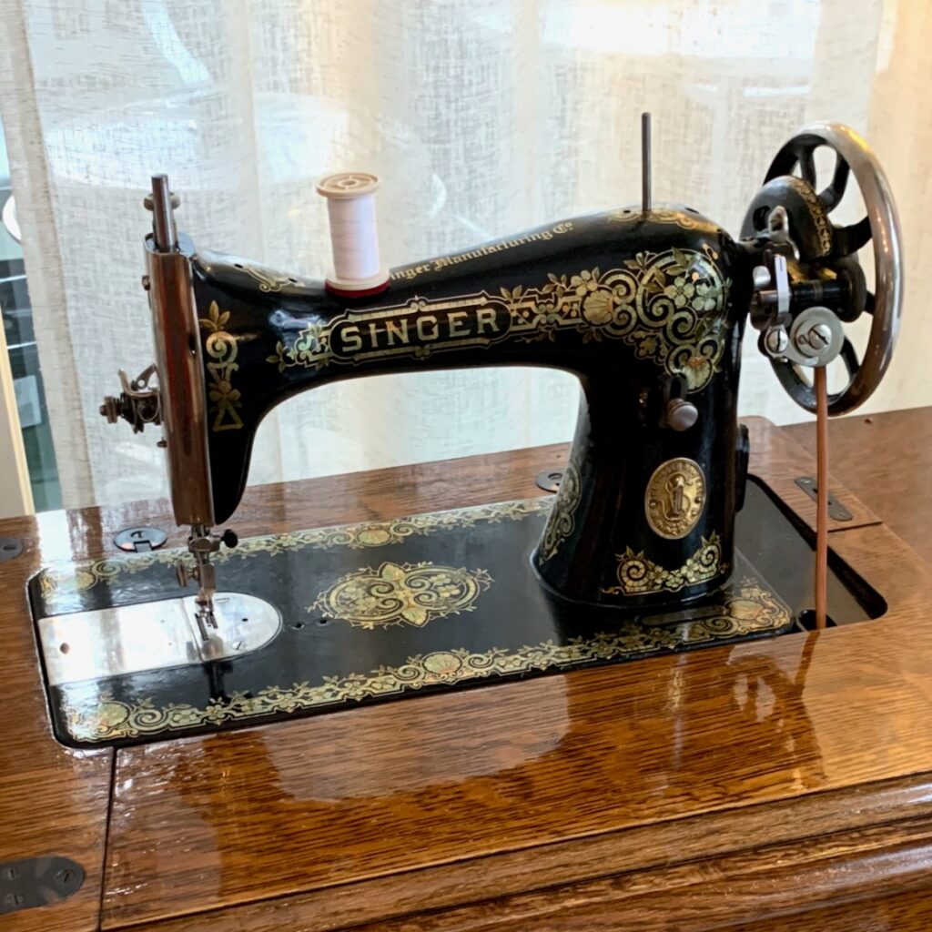 Photograph of vintage Singer sewing machine.  Autobiography of Dr. Anthony J. Carbone.