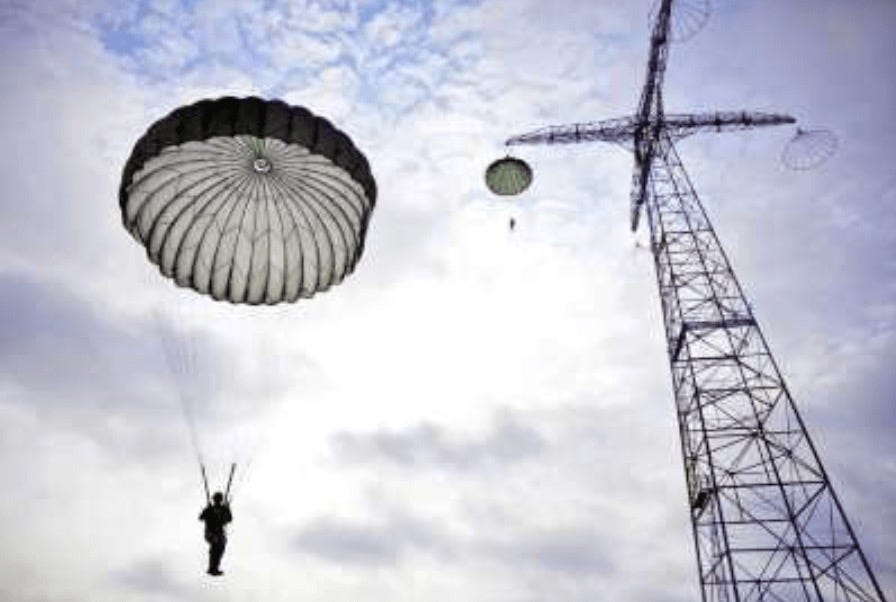 Rigging the chute for the 250-foot free drop tower at the U.S. Army Airborne Course at Fort Benning, Georgia.  Biography of Dr. Anthony J. Carbone.