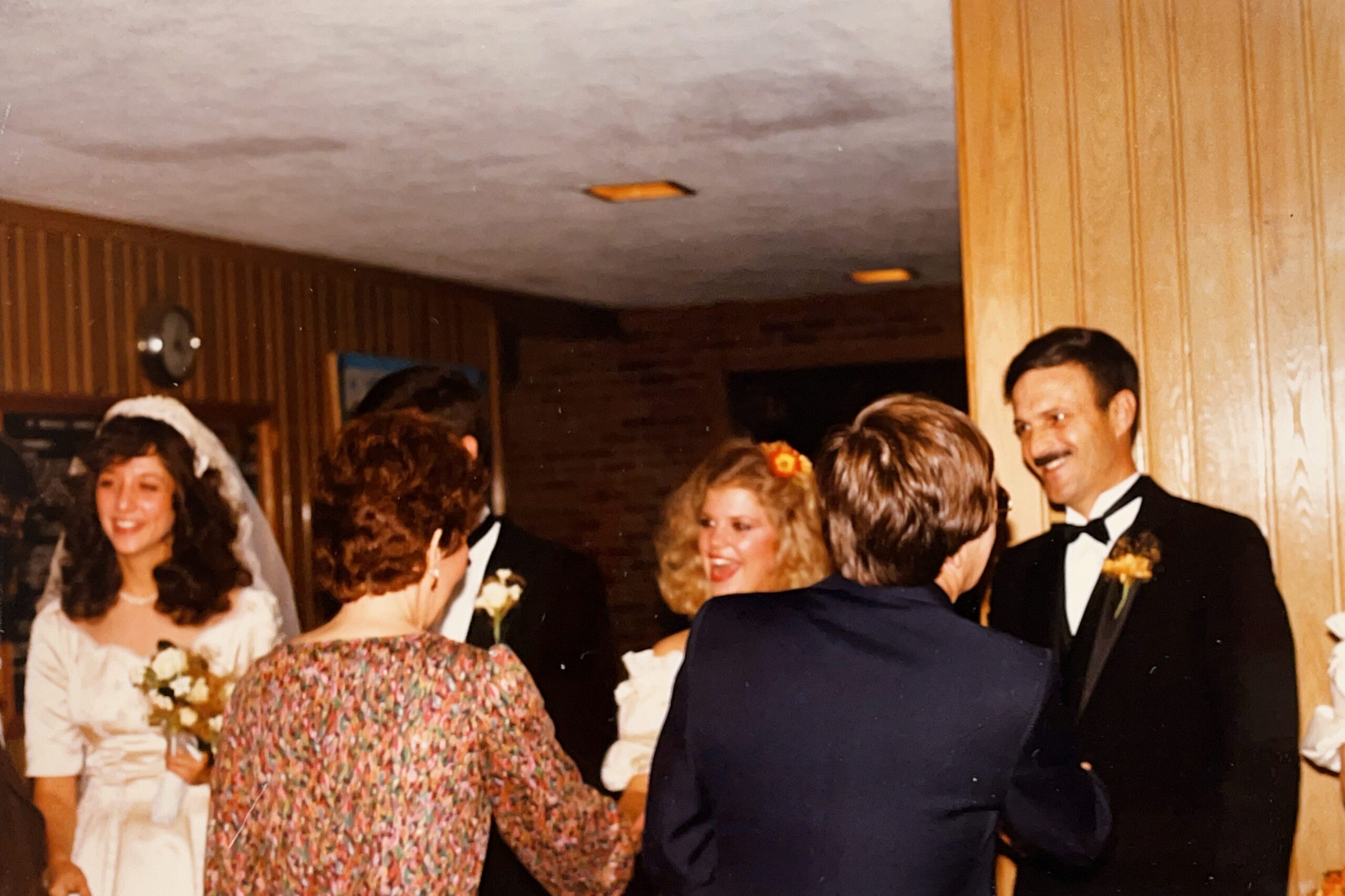The wedding reception line for Lieutenant & Mrs. Anthony J. Carbone on October 30, 1982 in Wheaton, Illinois.