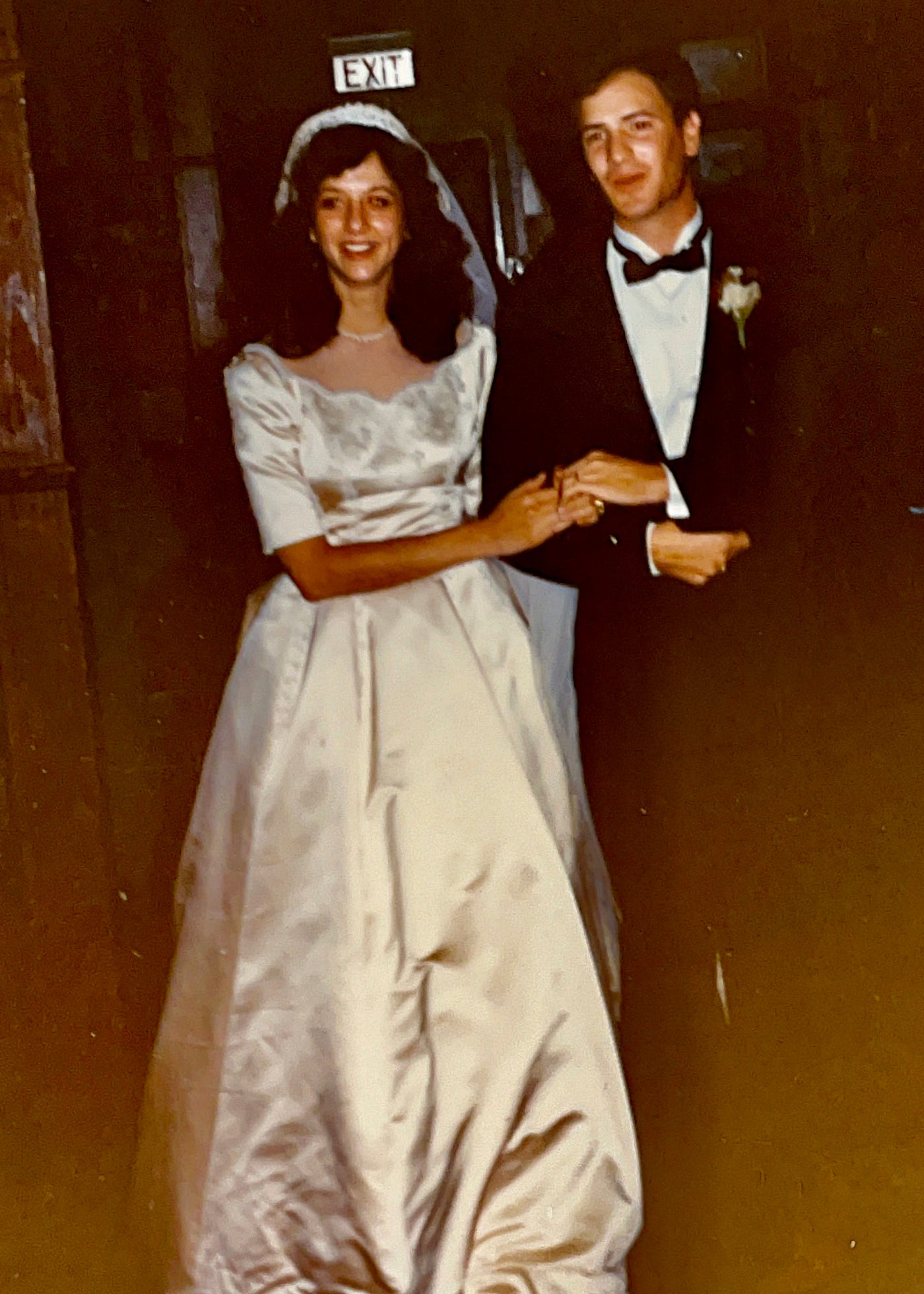 New bridge and groom enter the Wedding Reception Hall.  Marriage of Mariann Schmitz to Anthony J. Carbone on October 30, 1982.