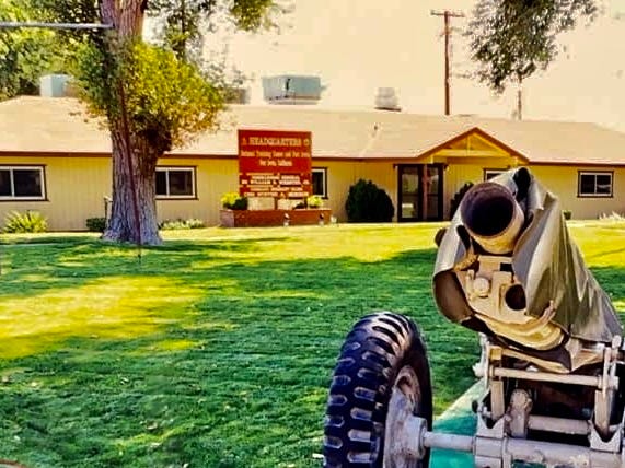 National Training Center Headquarters building at Fort Irwin, California.  Biography of Dr. Anthony J. Carbone.