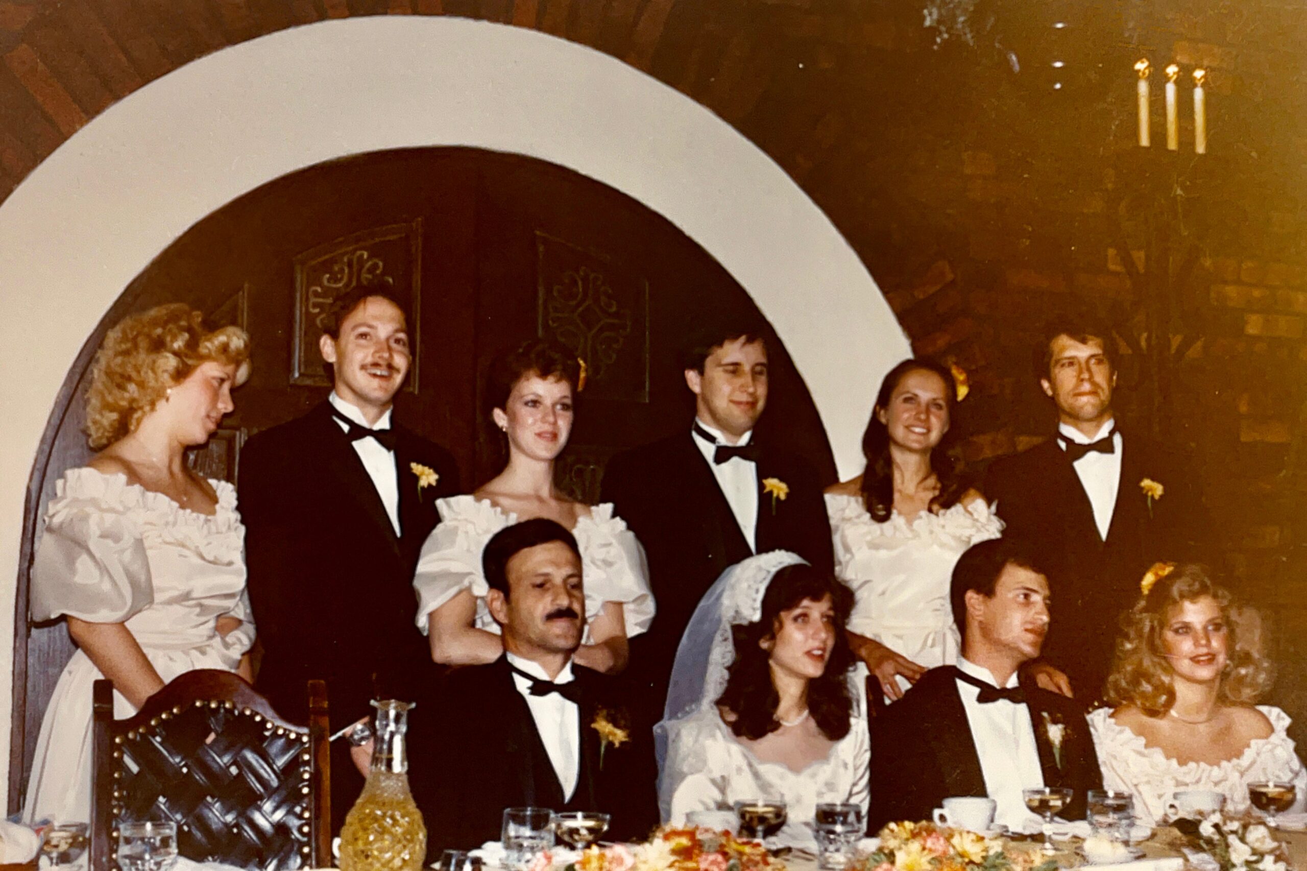 The wedding head table for the wedding of Lieutenant & Mrs. Anthony J. Carbone on October 30, 1982 in Wheaton, Illinois.