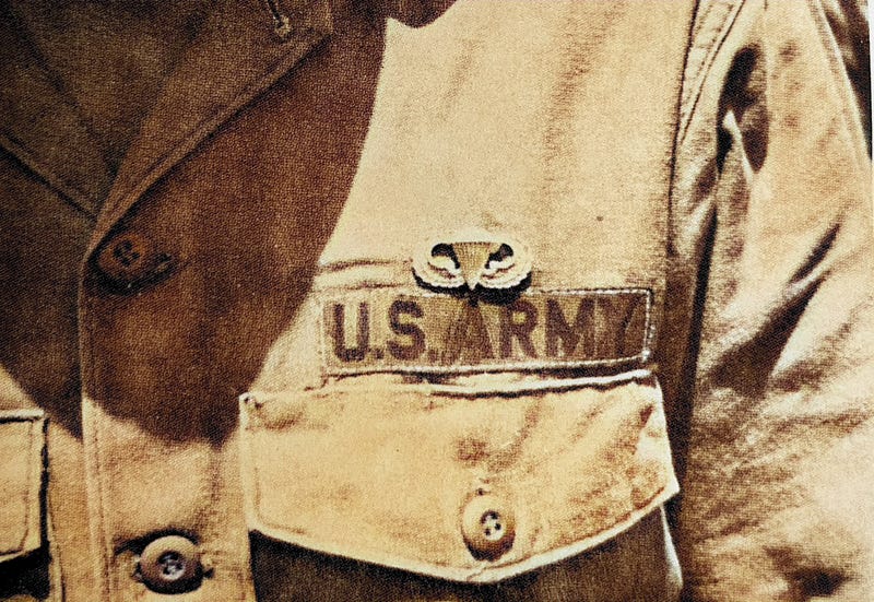 Newly earned Parachutist Wings on a paratrooper at the U.S. Army Airborne School.  Biography of Dr. Anthony J. Carbone.
