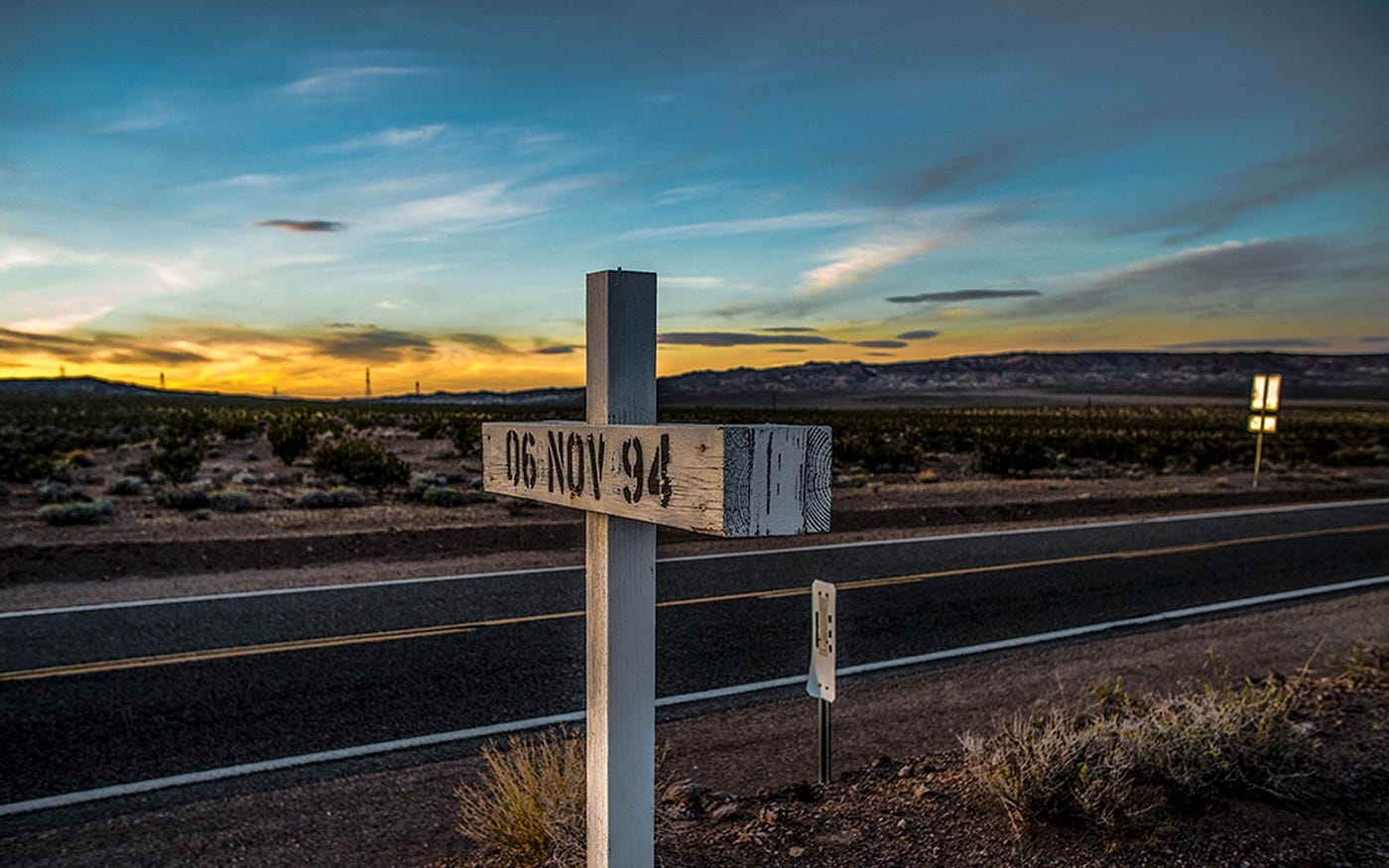 White Crosses along Fort Irwin Road where someone was killed.  Each contains the date of death.  Biography of Dr. Anthony J. Carbone.