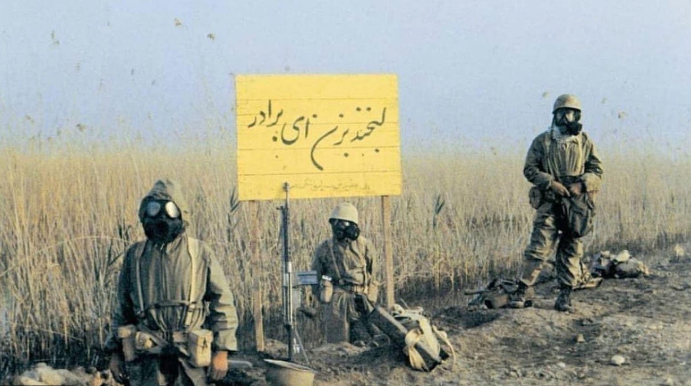 Iraqi chemical forces in protective gear. Biography of Dr. Anthony J. Carbone.