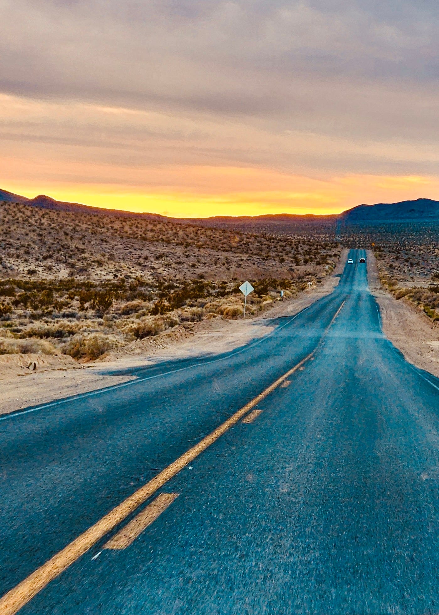 Fort Irwin Road in 1982 — Two lanes with sand-covered shoulders.  37 miles through the Mojave Desert.  Biography of Dr. Anthony J. Carbone.