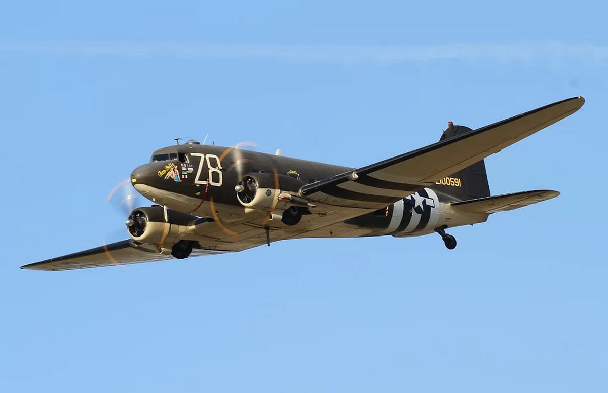 C-47 Skytrain "Gooney Bird" dropping paratroopers at the U.S. Army Airborne School at Fort Benning, Georgia.  Biography of Dr. Anthony J. Carbone.