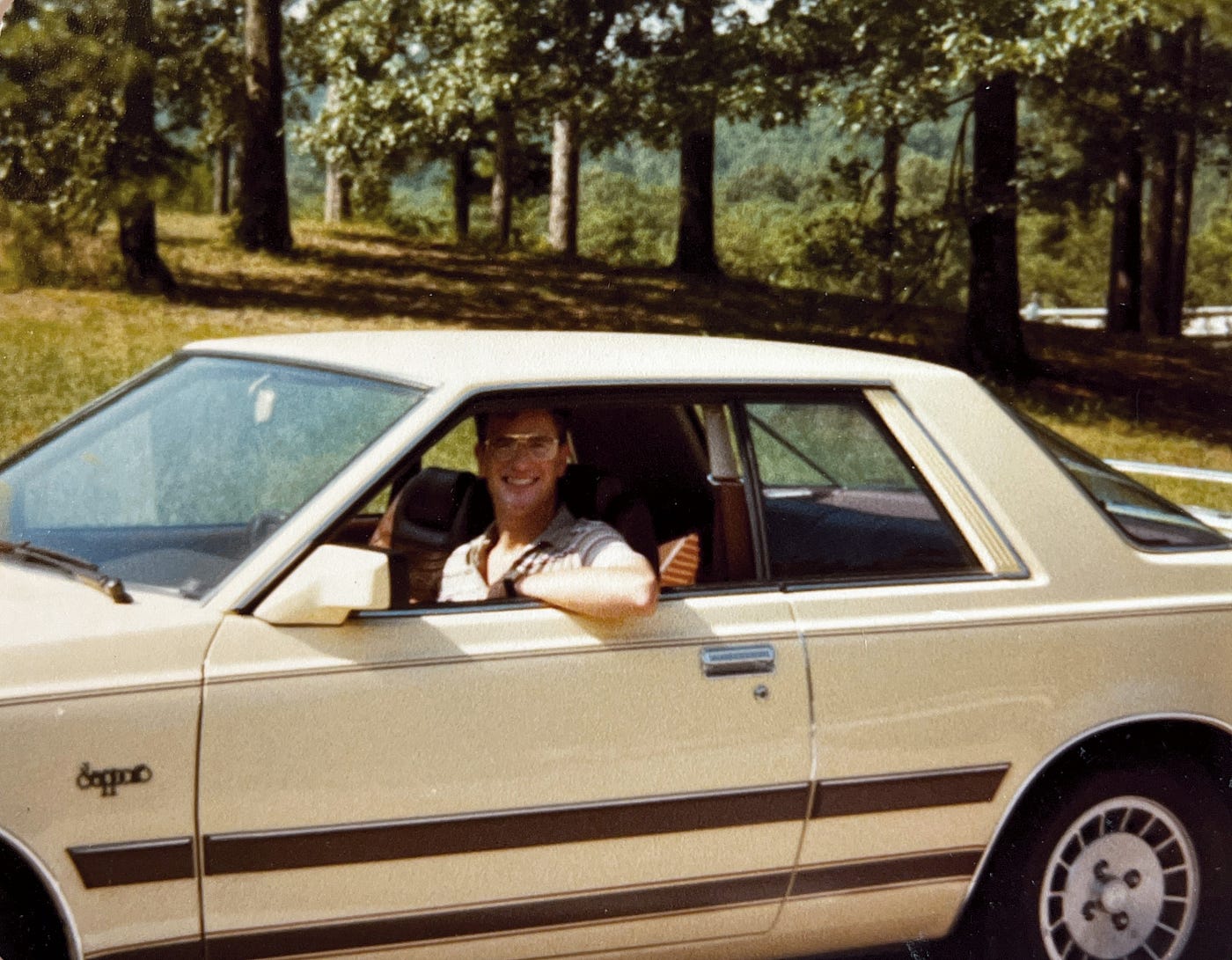 Anthony J. Carbone driving his new yellow Plymouth Sapporo.