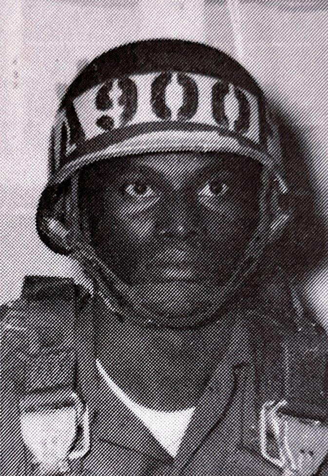 Allied Officer, 2LT Mbanga Bona (A900F) from Zaire at the U.S. Army Airborne School, Fort Benning, Georgia.  Biography of Dr. Anthony J. Carbone.