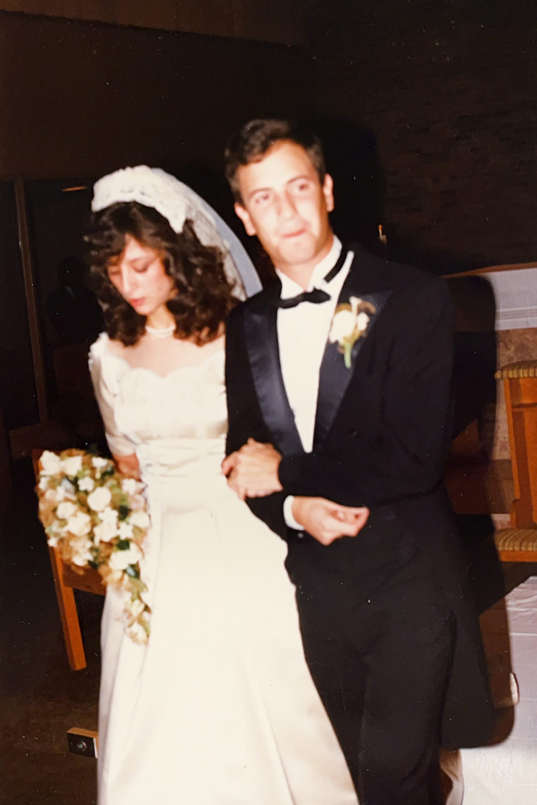 Groom (Lieutenant Anthony J. Carbone) and Bride (Mariann Schmitz Carbone) walking down the aisle of Saint Micheal's Catholic Church following their wedding on October 30, 1982.