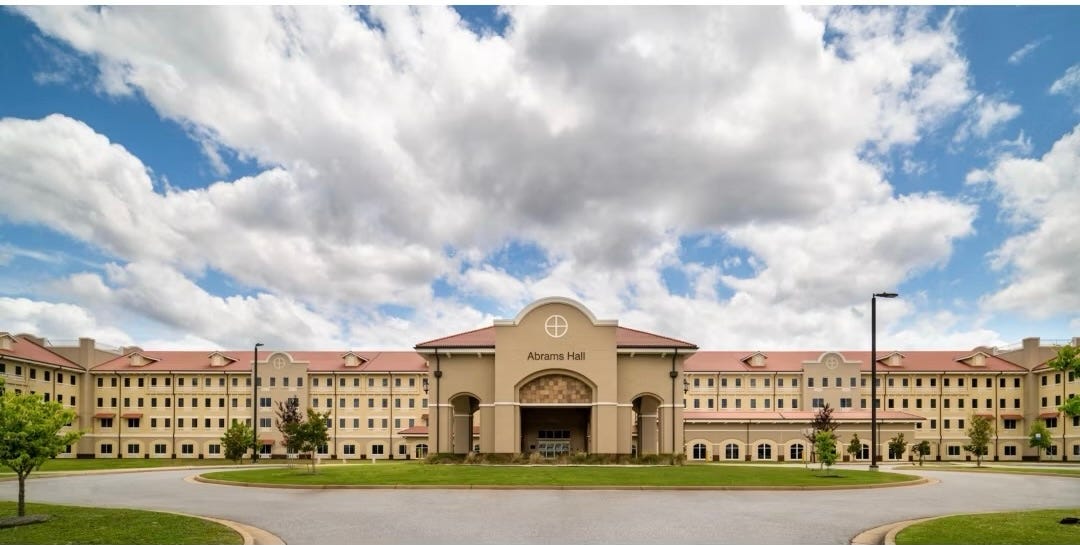 Abrams Hall that contained the Bachelor Officer Quarters (BOQ) at Fort Benning, Georgia.  Biography of Dr. Anthony J. Carbone.