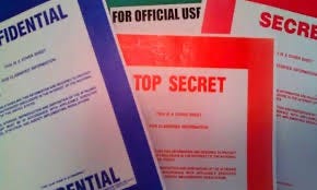 Photograph of cover sheets labeled “Top Secret”, “Secret”, “Confidential’ and “For Official Use Only”. Biography of Dr. Anthony J. Carbone.