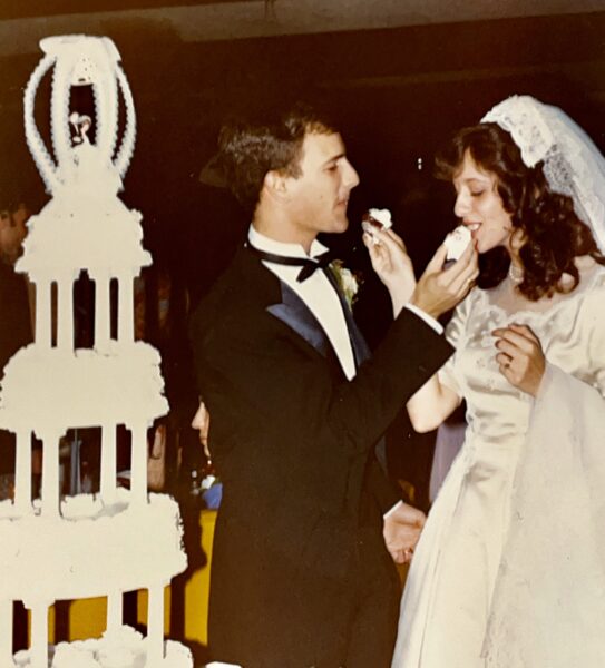 Groom (Lieutenant Anthony J. Cabone) and Bride (Mariann Schmitz Carbone) sharing thier wedding cake on October 30, 1982 in Wheaton, Illinlos