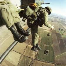 Final jump before graduation.  Paratroopers exiting door of C-130.  Biography of Dr. Anthony J. Carbone.