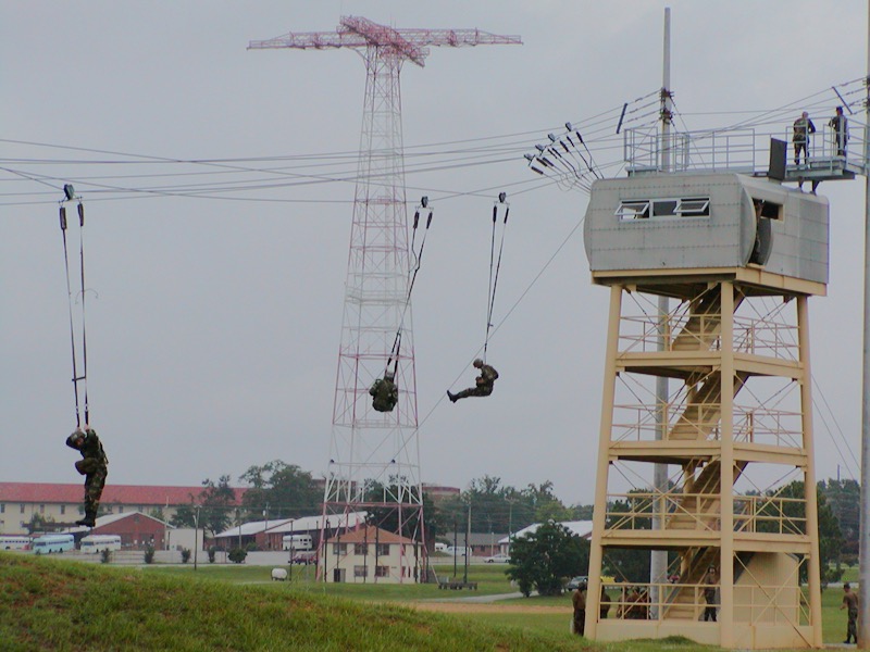 Jumping from the 34-foot tower at the U.S. Army Airborne School at Fort Benning, Georgia.  Biography of Dr. Anthony J. Carbone.