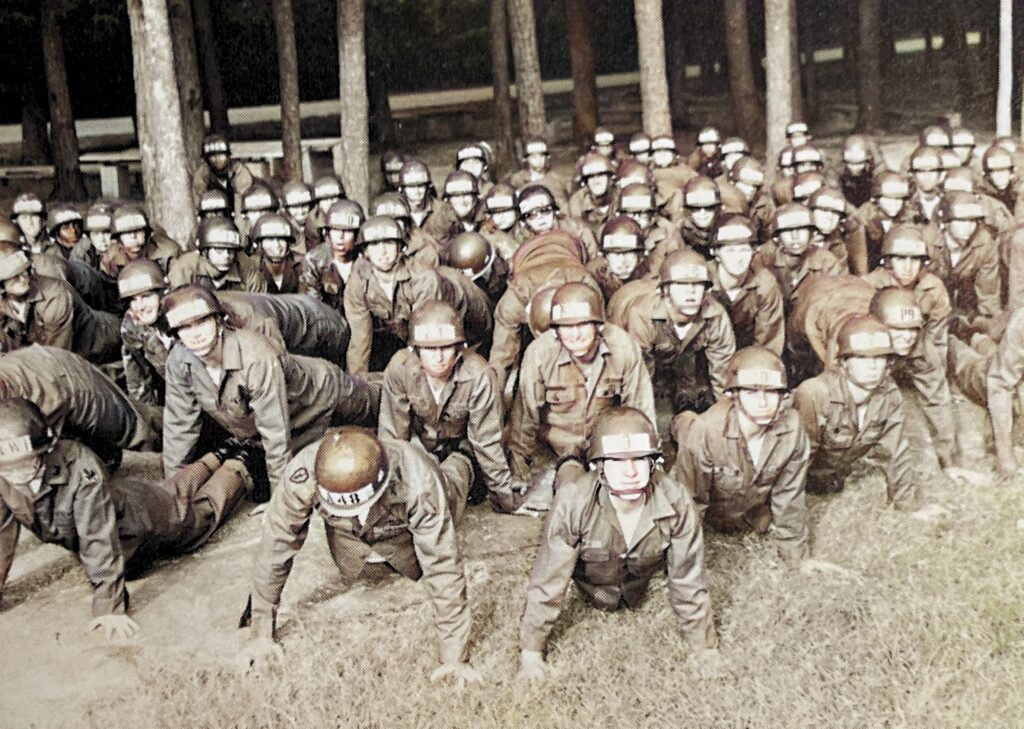 Members of the Airborne Course doing PT at Fort Benning.   Biography of Dr. Anthony J. Carbone.