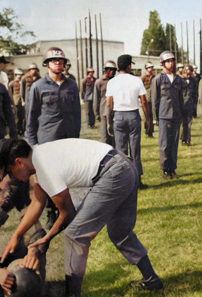 Black Hat instructors in white t-shirts with Airborne students.  U.S. Army Airborne School.  Biography of Dr. Anthony J. Carbone.