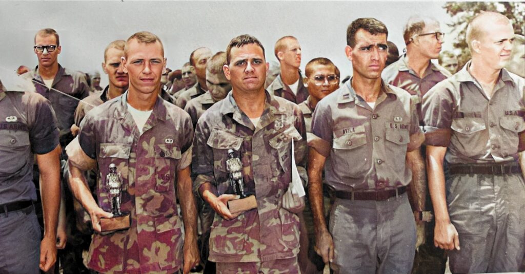 New graduates of the U.S. Army Airborne Course at Fort Benning, Georgia with Honor Graduates in front rank holding awards.  Biography of Dr. Anthony J. Carbone.