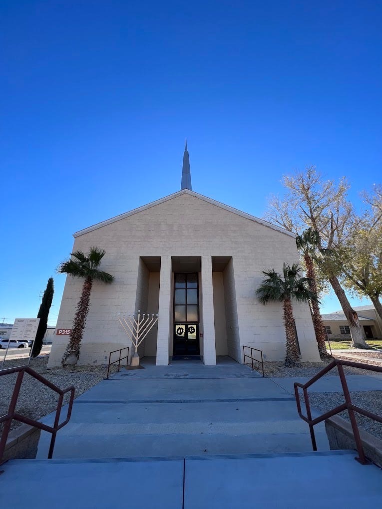 Photograph of Post Chapel at Fort Irwin, California.  Biography of Dr. Anthony J. Carbone.