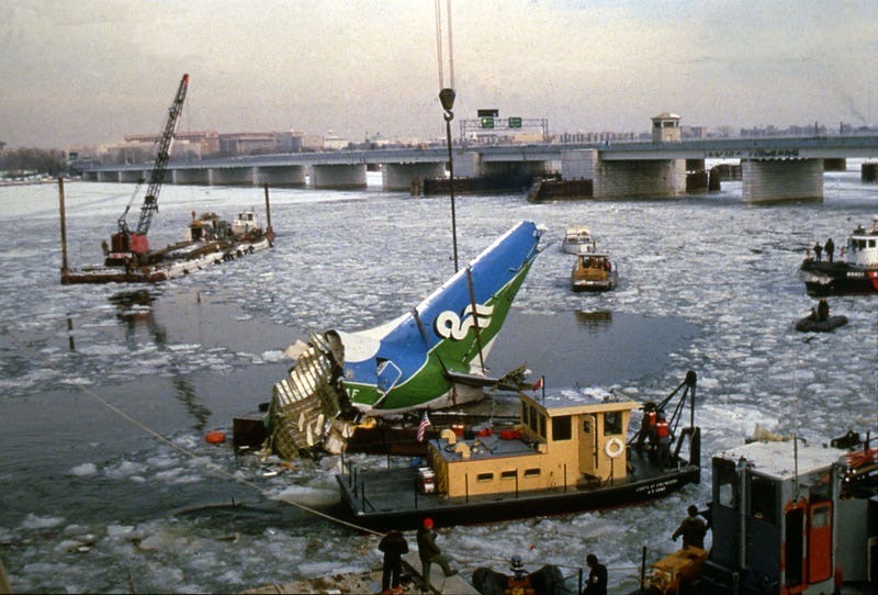 Recovery teams pulling tail of Air Florida flight 90 out of the Potomac River.  Biography of Dr. Anthony J. Carbone