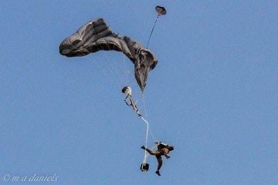 Photograph of military parachute malfunction.  Biography of Dr. Anthony J. Carbone