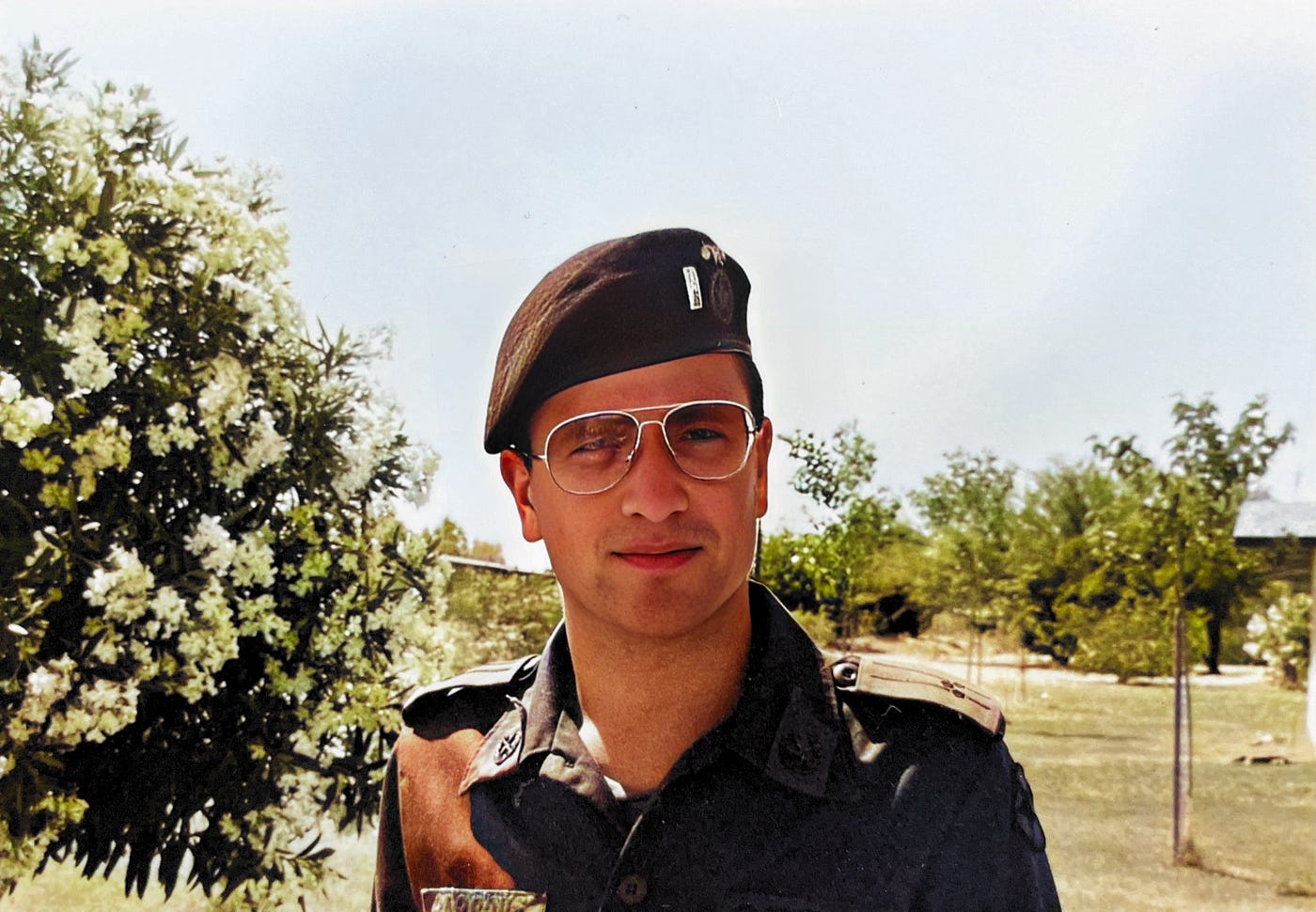 1LT Anthony J. Carbone in OPFOR uniform with black OPFOR beret with silver bar of 1st lieutenant and gold crossed retorts of the Chemical Corps.