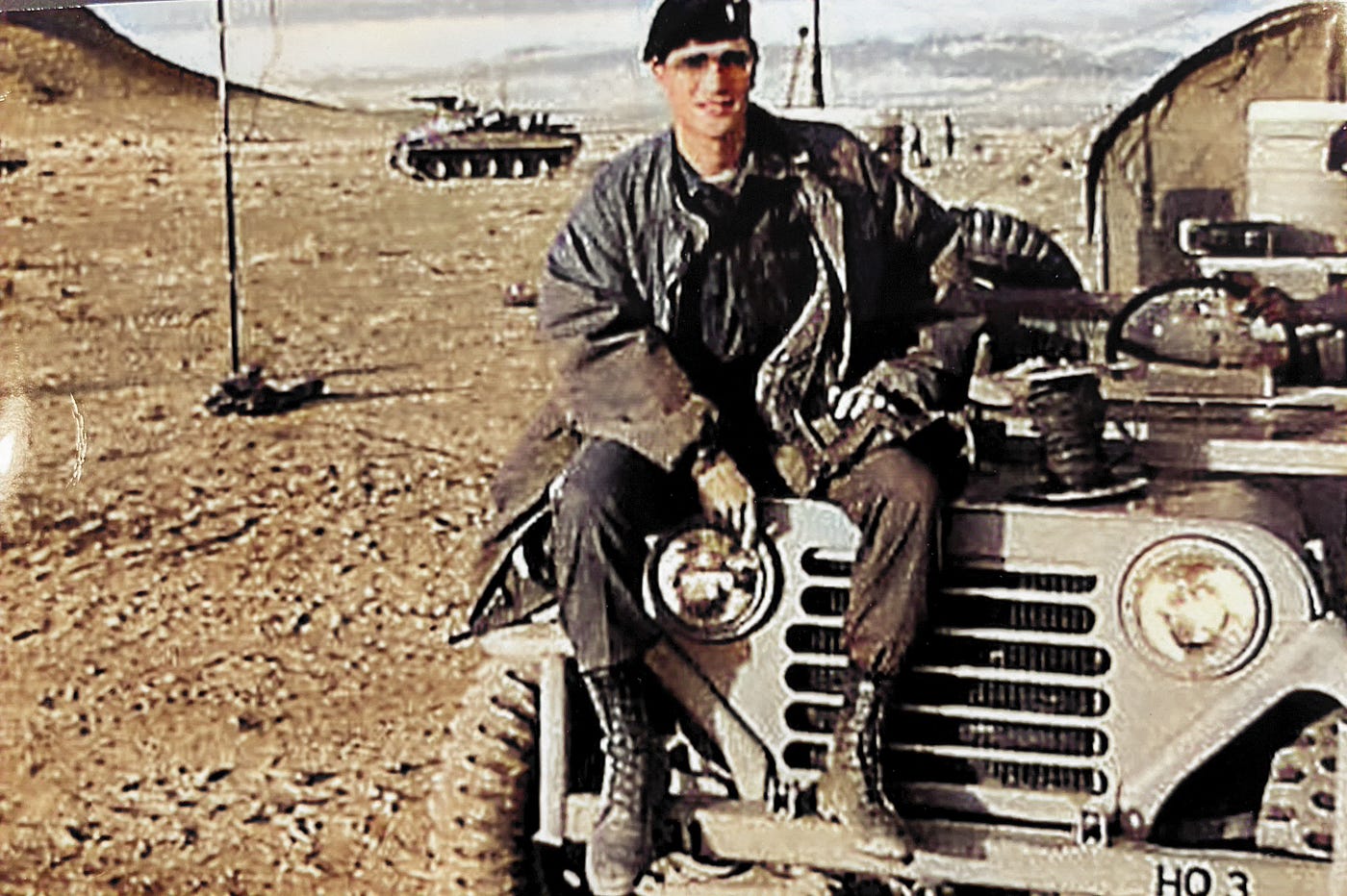 1LT Anthony J. Carbone (Battalion Chemical Officer/Assistant S3) Sitting on the S3’s Jeep at the Tactical Operations Center (TOC) somewhere near Death Valley