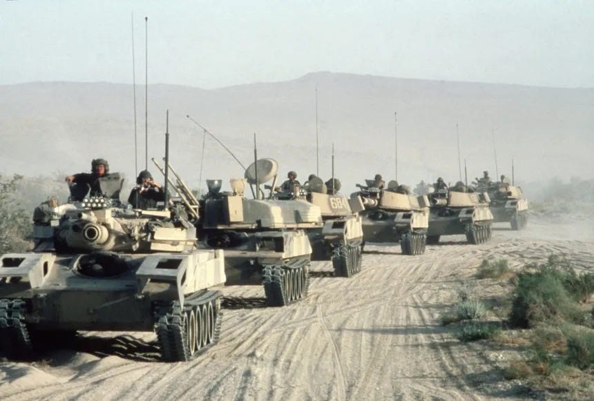 Line of M551 VISMODs with Soviet BMP followed by ZSU 23–4 and several T-72 Tanks.  National Training Center at Fort Irwin, California.  Biography of Dr. Anthony J. Carbone.