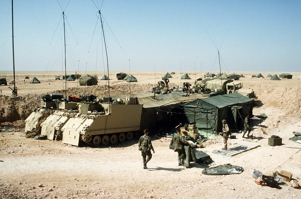 M577 Command Post Carriers lined up to form a large Tactical Operations Center (TOC)