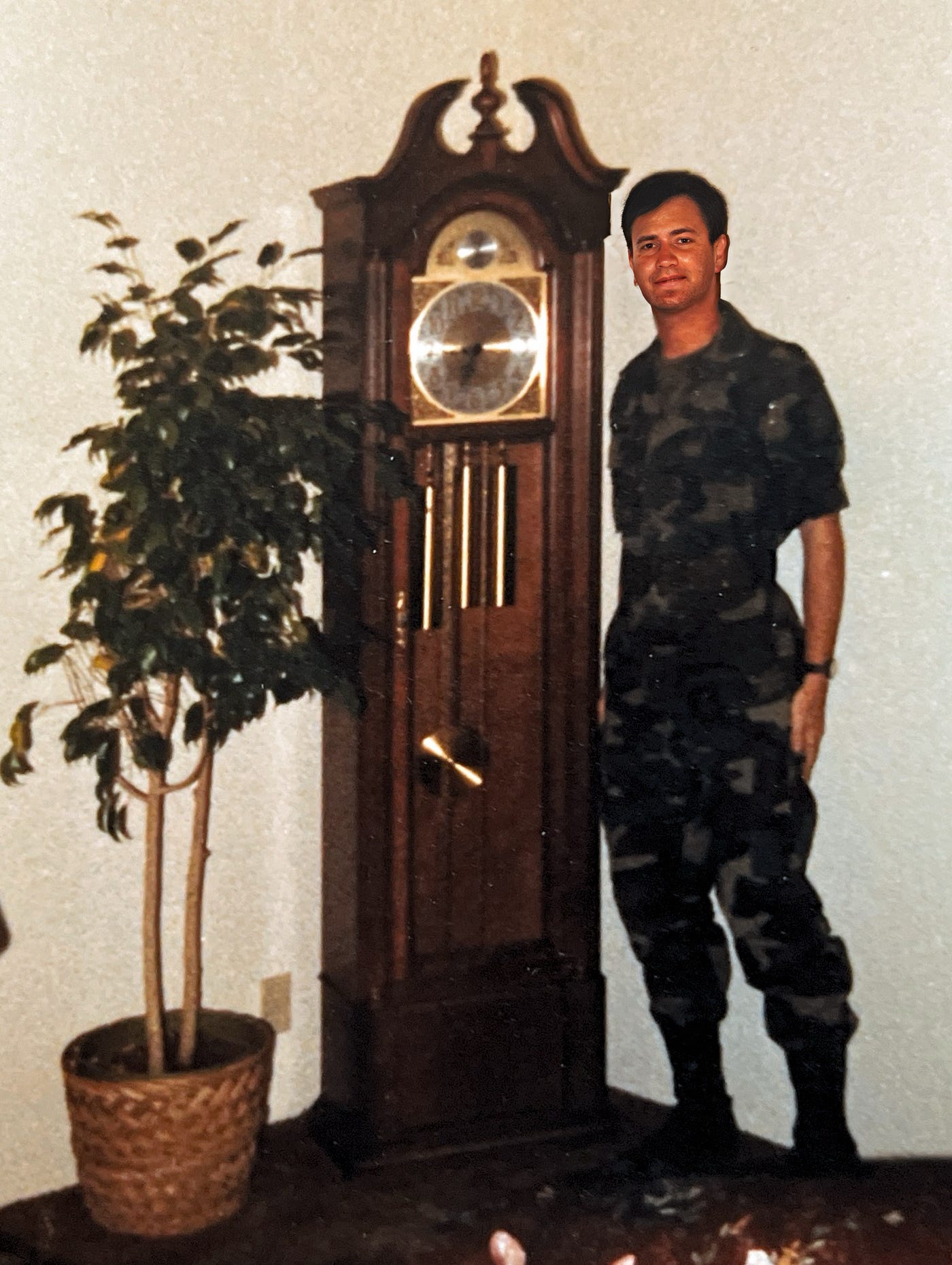 2LT Anthony J. Carbone in Battle Dress Uniform (BDUs) in our government quarters at Fort Irwin.  Grandfather clock was a wedding gift from my father.