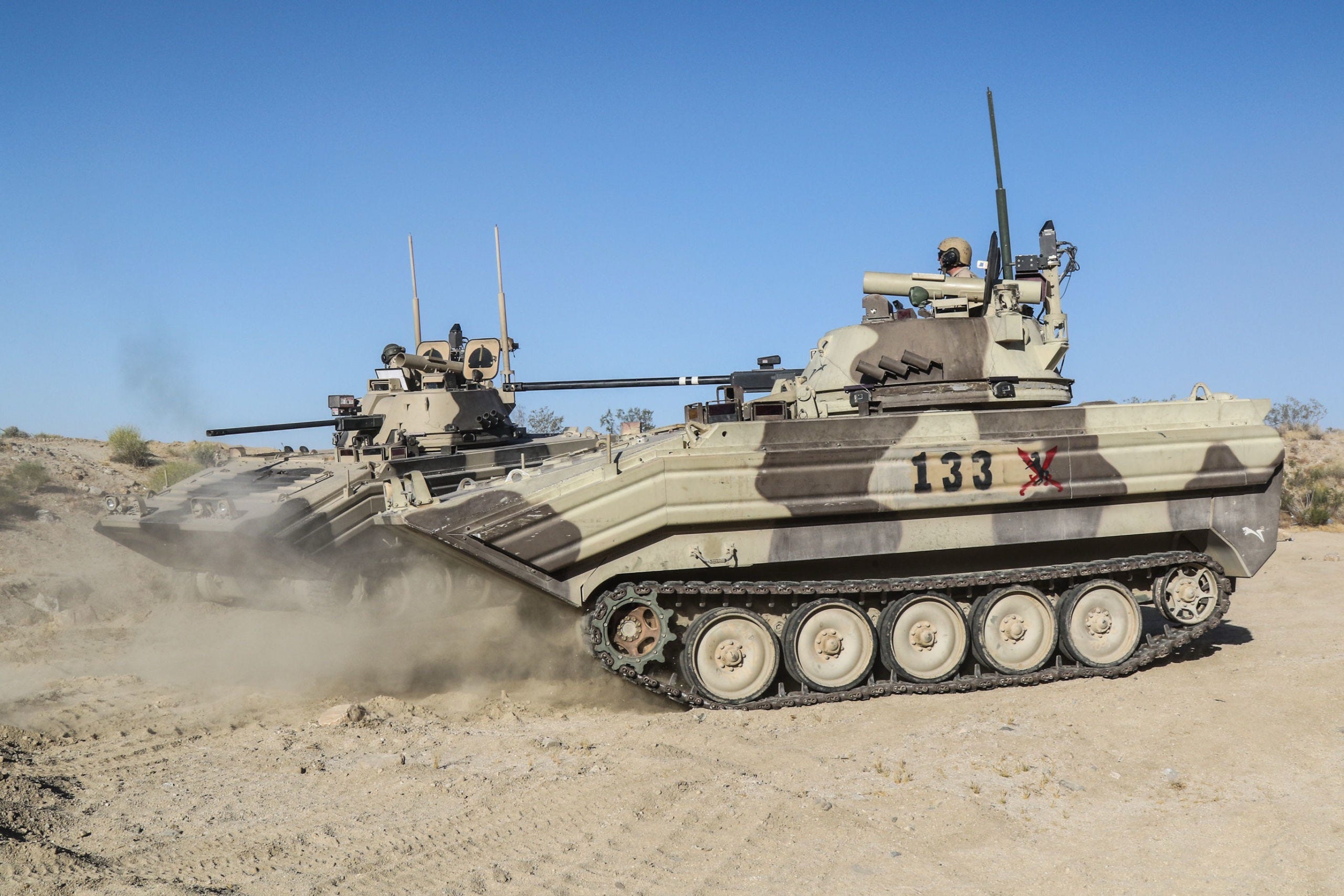 U.S. vehicles visually modified (VISMODs) to look like Soviet BMPs (Infantry fighting vehicles). At the National Training Center at Fort Irwin, California.  Biography of Dr. Anthony J. Carbone
