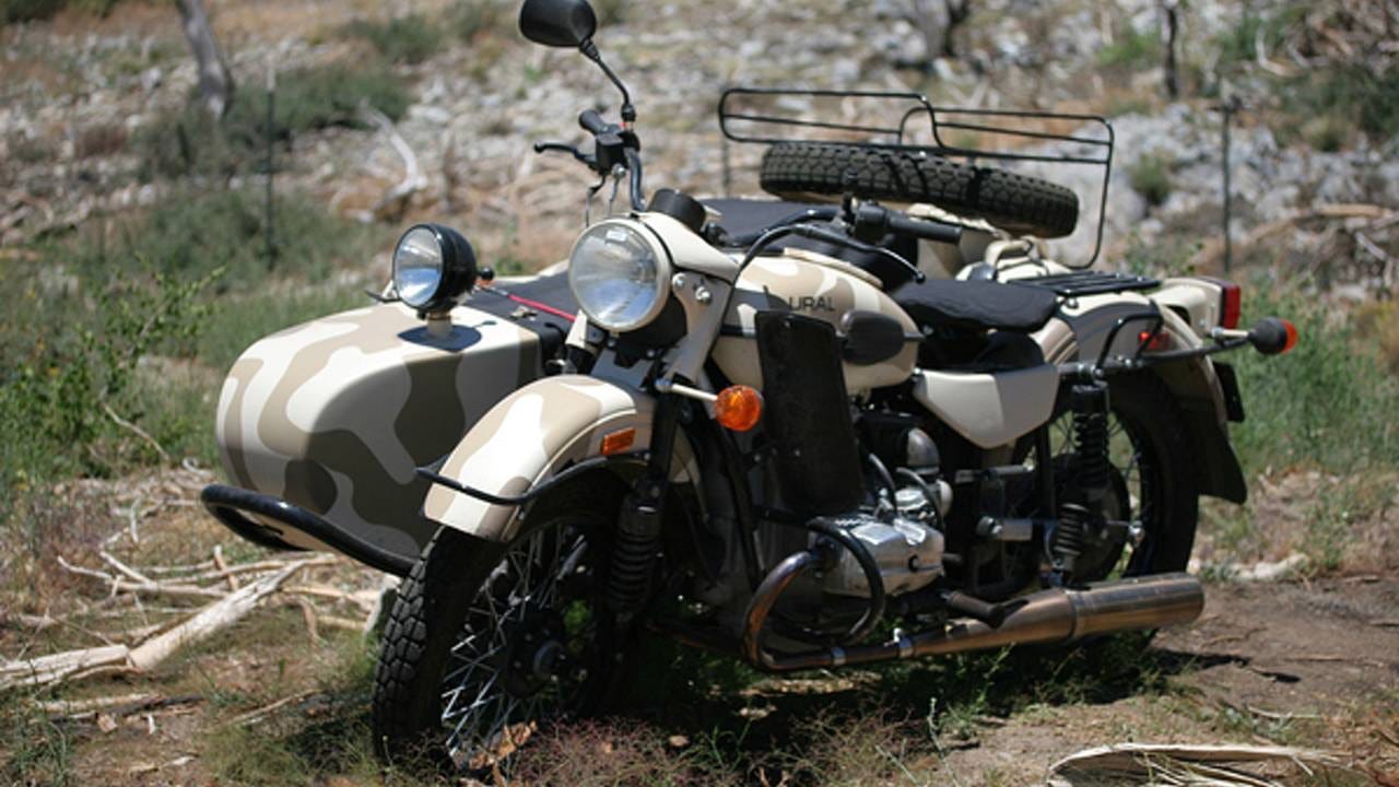 Soviet motorcycle with sidecar used by Soviet messengers.  Biography of Dr. Anthony J. Carbone.