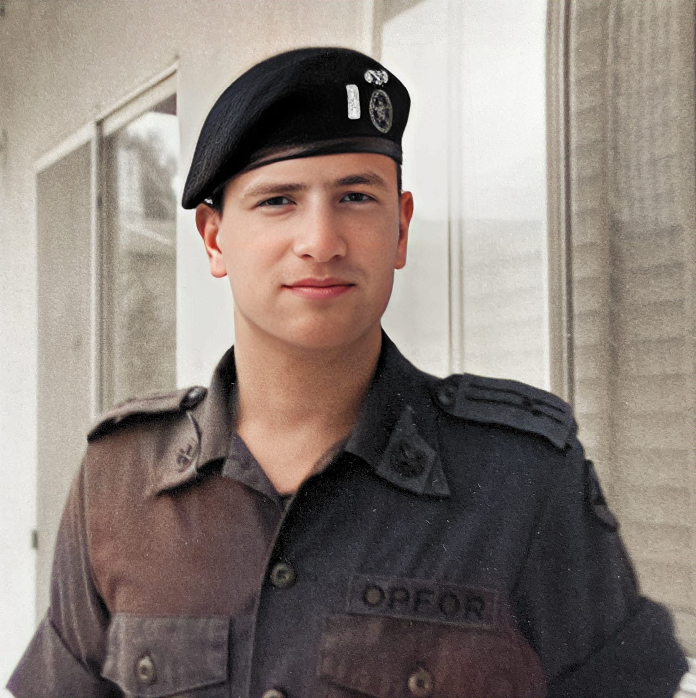 1LT Anthony J. Carbone wearing his  OPFOR uniform with a black beret with my 1LT silver bar and Chemical Corps crossed retorts. The three dots on my epaulettes indicate that I am a “Soviet” Senior Lieutenant.