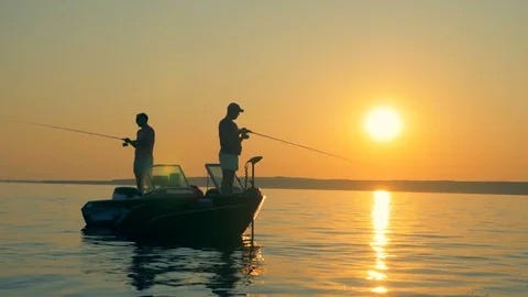 Two men fishing from a small boat on a large lake as the sun rises.
Biography of Dr. Anthony J. Carbone.