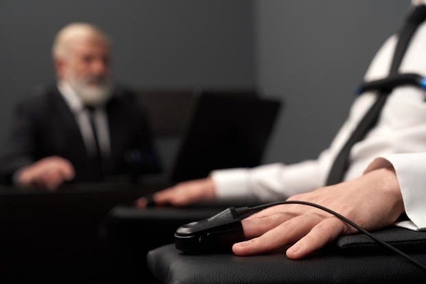 Polygrapher testing a CIA applicant with a polygraph machine.
Biography of Dr. Anthony J. Carbone.